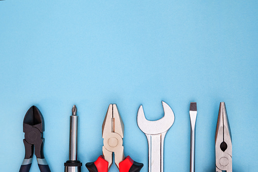 six different tools on blue background